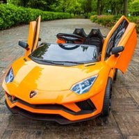 an orange toy car with open doors sitting on a brick walkway in front of some bushes