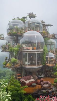 an unusual house built into the side of a cliff with plants growing on it's roof