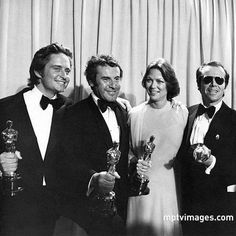 three men and two women holding their oscars