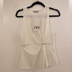 Sleeveless Tank Top From Zara. New With Tags. Size S. Chic Sleeveless Summer Vest, Chic Sleeveless Camisole For Day Out, Chic Sleeveless Summer Tank Top, Chic Sleeveless Vest Top, White Sleeveless Tank Top For Party, Chic White Cami Tank Top, Chic Cami Vest For Spring, Chic Spring Tank Vest, Elegant Tank Top For Day Out