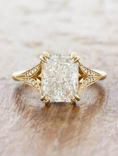 a yellow gold engagement ring with an old cut diamond