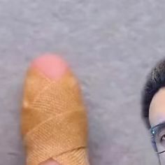 a man with a bandaged foot and eyeglasses