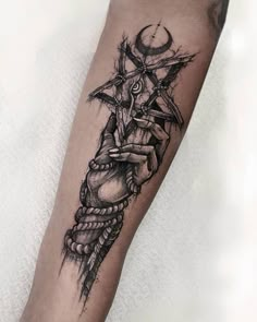 a black and white tattoo on the leg of a person