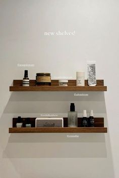 two wooden shelves with different types of items on them and the words new shelves above