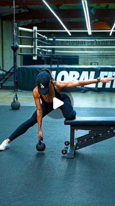 a woman doing push ups on a bench in a gym