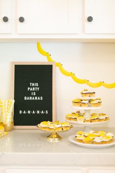 this party has bananas and cupcakes on the table