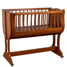 a wooden baby crib sitting on top of a table