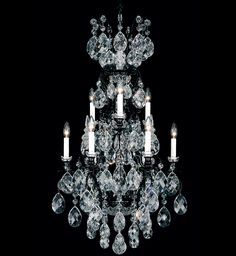 a crystal chandelier with candles in it