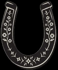 a black and white horseshoe with flowers on it