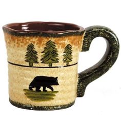 Our Rustic Animal Mug set adds a charming cabin touch to your dining or coffee table with its warm earth colors and wilderness-inspired motifs. Each mug showcases hand-painted scenes of moose, deer, elk, or bear roaming amidst pine trees, complemented by uneven edges for a unique, homespun pottery look. Complete a warm, cabin-inspired table setting when you coordinate with our Rustic Bear Collection and other cabin or lodge-themed collections. WHAT'S INCLUDED: 4 Mugs DIMENSIONS: 4.5"W x 6.75"L x Rustic Dinnerware, Lodge Design, Moose Mug, Ceramic Dinnerware Set, Cabin Lodge, Animal Mugs, Lodge Style, Ceramic Dinnerware, Rustic Lodge