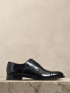 The perfect dress shoe, these timeless leather oxfords have a subtle, cap-toe construction, beautifully crafted for us in Portugal of exceptional, timeless leather.  Leather uppers.  Waxed laces.  Leather soles.  Made in Portugal.  Whole and half sizes. Mens Fashion Rugged, Black Oxfords, Shoe Inspo, Latest Mens Fashion, Dress Shoe, Leather Cap, Shoes Shop, Mens Oxfords, Shop Mens Clothing