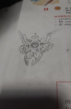 a piece of paper with a drawing of an owl on it's back side