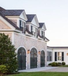 a large white house with black doors and windows