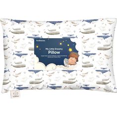 a pillow with an image of a boy sleeping on the clouds