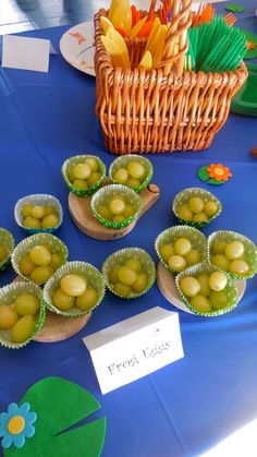 there are many small cups with food in them on the table next to each other