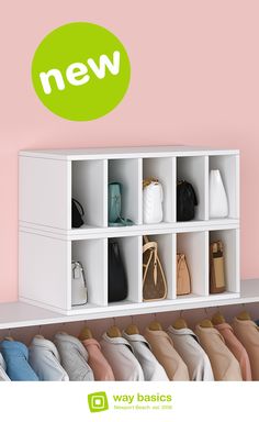 there is a white shelf with shoes and purses on it next to a pink wall