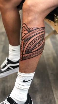 a man with a tattoo on his leg