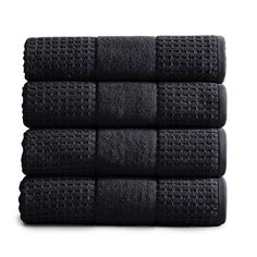 four black towels stacked on top of each other