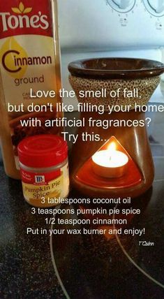 a candle and some jars on a table with information about how to use cinnamon spice