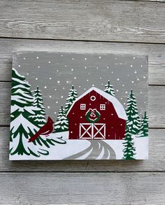 a painting of a red barn in the snow with a cardinal on it's roof