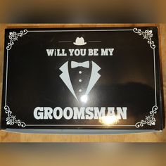 a sign that says, will you be my groomsman? with a tuxedo and bow tie on it