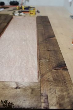 a wooden table topped with lots of different types of wood