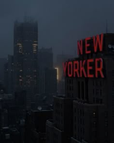 the words new york are lit up on top of buildings