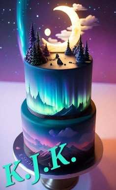 a multi - layered cake decorated with an aurora bore and the moon in the night sky