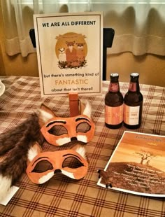 a table topped with two masks and bottles