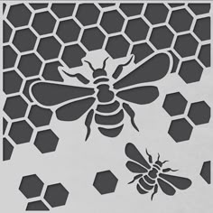 a bee and honeycomb cutout on a piece of paper