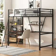 a loft bed with a desk underneath it in a room next to a chair and table