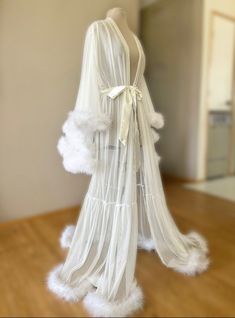 "Long white sheer marabou feather robe with satin sash. Beautiful for boudoir, bridal and maternity shoots! Also just nice for a romantic night, getting ready or lounging at home! PLEASE MSG ME YOUR HEIGHT IF YOU REQUIRE TALLER THAN 5'8\" WITH HEELS/SHOES Comes in all colors and sizes (message for info). All of these are handmade to order. For custom color requests please allow time for me to get materials and make it." White Sheer Robe, White Feather Robe, White Fluffy Robe, Long White Robe, Long White Bridal Robe, Wedding Night Outfit Brides, Bridal Robes Long, Bridal Morning Robe, Loungewear Business