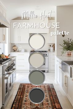 a kitchen with white cabinets and an area rug that has different shades of paint on it