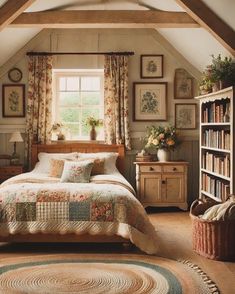 a bed sitting under a window in a bedroom next to a book shelf filled with books