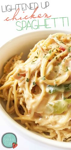 a white bowl filled with pasta and vegetables