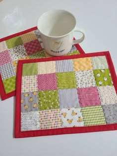 two placemats and a coffee cup on a table