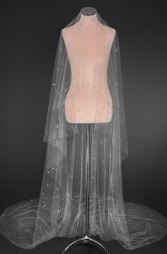 a mannequin with a veil on top of it