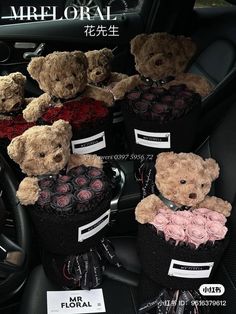 several teddy bears are sitting in the back seat of a car with roses on it