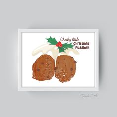 a christmas card with two chocolate chip cookies and holly on the top, in white frame