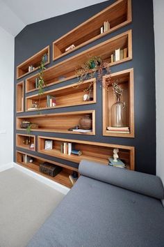 a living room filled with lots of wooden shelves