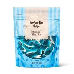 a bag of gummy sharks sitting on top of a white table