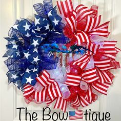 the bowtiqueue is decorated with red, white and blue bows for patriotic day