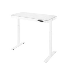 a white desk sitting on top of a white floor