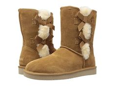 Koolaburra by UGG Victoria Short (Chestnut) Women's Boots For all the ladies looking for a little bit of seasonal sweetness the Koolaburra by UGG Victoria Short boots are just for you. Soft suede upper adorned with dainty bows and a row of plush exposed sheepskin. Slip-on design. Closed rounded toe. Faux-fur and shearling interior offer an amazing comfort experience. This product contains real fur: Sheepskin dyed and treated from Australia. D #KoolaburrabyUGG #Shoes #Boot #GeneralBoot #Brown Ugg Shoes Women, Boots For Short Women, Koolaburra By Ugg, Short Boot, Short Fashion, Boots Women Fashion, Real Fur, Branded Bags, Boots For Sale