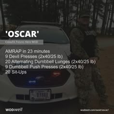 a man standing next to a white car with the words oscar written in front of it