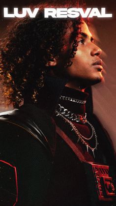 a man with long curly hair wearing a black jacket and chain necklaces on his neck