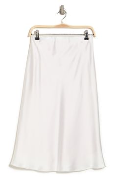 Elevate your wardrobe with this pull-on bias satin midi skirt for elegant, feminine style. 31" length (size S) Elasticized waist Pull-on style Satin construction 97% polyester, 3% spandex Machine wash cold, line dry Made in USA Model’s stats for sizing: 5’10” height, 34” bust, 27” waist, 35” hips. Model is wearing size S. Elegant Bias Cut Midi Skirt, Spring Formal Satin Maxi Skirt, White Flowy Satin Maxi Skirt, White Midi-length Bottoms For Evening, White Midi Length Bottoms For Evening, Fitted White Satin Maxi Skirt, White Satin Lined Skirt, Chic White Silk Maxi Skirt, Relaxed Midi Skirt With Bias Cut