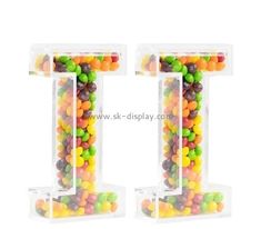 two clear plastic letters with jelly beans in the letter i and 2 on each side