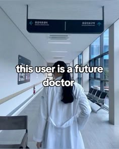 a woman walking down a hallway with the caption, this user is a future doctor