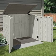 an outdoor storage shed with the door open